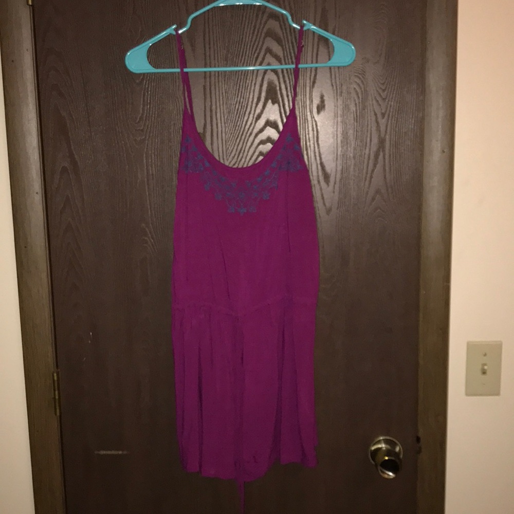 Plum colored romper with dark purple floral